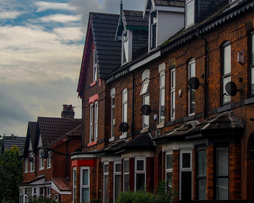Brick terraces with bay fronts along a residential street