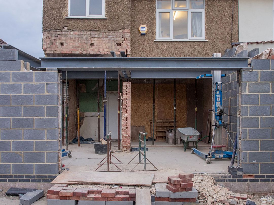 A part-built rear extension with steel and blockwork